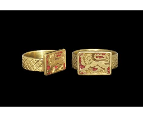 16th century AD or later. A broad flat-section hoop with repeated cross cleché design; rectangular bezel with reserved lion p