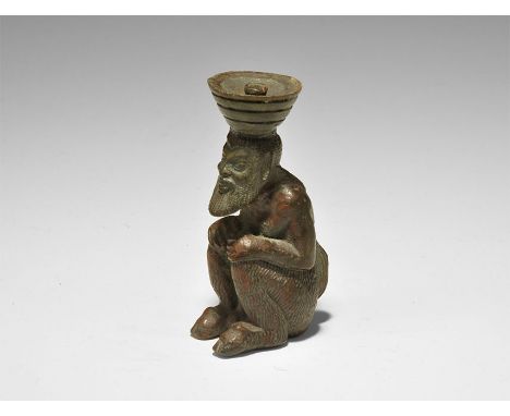 19th century AD. A bronze figure of a crouching ithyphallic satyr with hands resting on the knees, horse tail to the rear, be