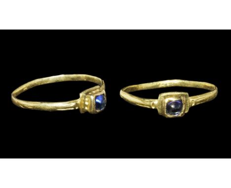 13th-15th century AD. A gold hoop with ribbed shoulders, square bezel set with a sapphire cabochon. Cf. Taylor, G. & Scarisbr