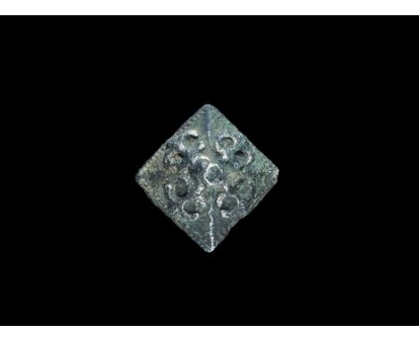 6th century AD. A hollow-formed silver pyramid mount from a sword belt with scrolled motif to each face, knop finial. Cf. Men