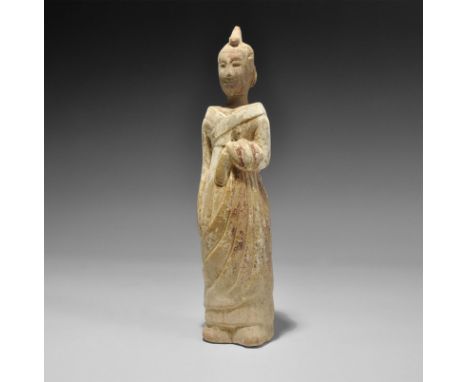 Northern Wei Dynasty, 386-534 AD. A slender ceramic figurine of a robed attendant with jacket and long garment looped over th