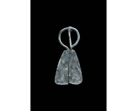 12th-14th century AD. A silver Mordvinian round-section penannular brooch with parallel plaque extensions, panels of reserved