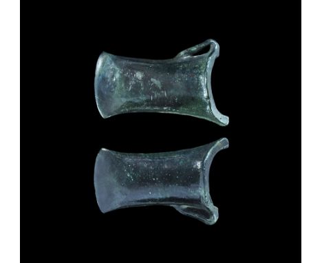 800-500 BC. A bronze looped and socketted axehead with slightly flared cutting edge; thickened collar to mouth and elongated 