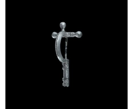 3rd-4th century AD. A silver bow brooch with three onion-shaped knops to the arm, deep bow and rectangular footplate; the upp