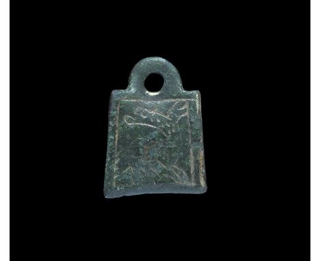 9th-12th century AD. A gilt-bronze Scandinavian type pendant with slightly convex plaque and pierced lug; incised border and 