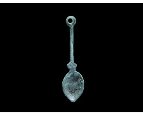 Late 10th-middle 12th century AD. A bronze miniature Scandinavian type spoon pendant (also widespread in the historical Rus r