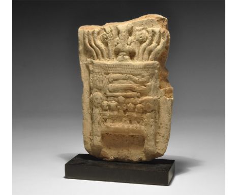 2nd millennium BC. A ceramic plaque with image of an table in high relief comprising two short legs, vertical posts with five