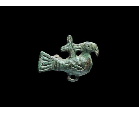 10th century AD. An Anglo-Scandinavian bronze plate brooch of a bird in profile with equal-arm cross on its back, linear deta