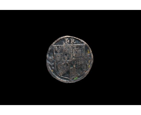 17th century AD. A flat-section bronze disc with design to one face comprising a heater shield with rose and thistle, initial