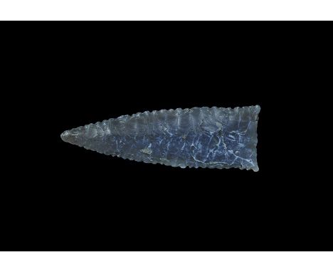Neolithic, 4th-2nd millennium BC. A late period fully bifacial projectile point of long triangular form with slightly concave