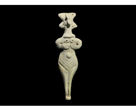 Syro-Hittite States, 1180-700 BC. A D-section terracotta idol with applied facial features, necklace, breasts and navel; impr