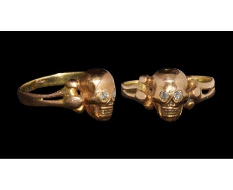 19th century AD. A flat-section hoop with shoulders formed as long bones, D-section skull bezel with inset diamonds to the ey