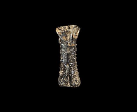 3rd-5th century AD. An aubergine glass double unguentarium comprising two narrow tubes with globular bottoms, applied trail r