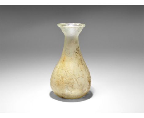 1st-2nd century AD. A clear glass jar with funicular neck, chamfered rim. Cf. Whitehouse, D. Roman Glass in the Corning Museu