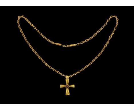 Later 6th century AD. A substantial gold cruciform pendant with four hollow bottle-shaped arms, each with incised median line