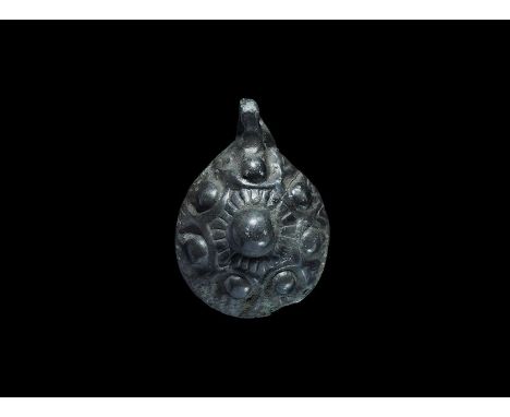 10th-12th century AD. A domed bronze mount with raised bosses and radiating lines; hollow to the reverse.    8.51 grams, 36mm