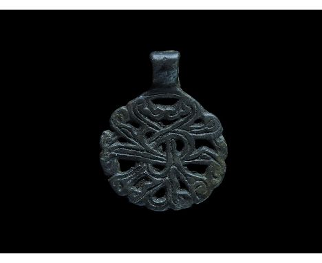9th-12th century AD. A bronze Scandinavian type pendant with integral loop, openwork trefoil motif with radiating tendrils.  
