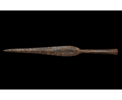 5th-1st century BC. A hand-forged iron spearhead of La Tène I type with narrow leaf-shaped blade lentoid in section, tubular 