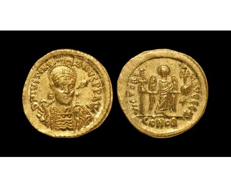 527-538 AD. Constantinople mint. Obv: D N IVSTINI-ANVS P P AVG legend with helmeted and cuirassed bust facing, holding cross 