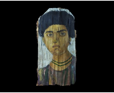1st-2nd century AD. A fabric-backed wooden veneer panel with painted portrait of a female in dark red robe with two-strand ne