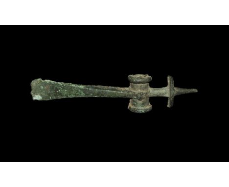 2nd millennium BC. A large narrow facetted triangular bronze blade with straight cutting edge, elliptical-section tubular soc
