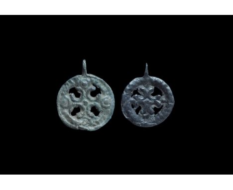 10th-12th century AD. A pair of bronze Scandinavian type pendants, each discoid with raised rim and pierced suspension lug, c