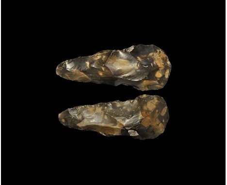 Mesolithic, 30000-15000 BP. A large and well-formed bifacial axe with pointed butt and convex cutting edge, of heavy cross-se