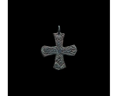 10th-12th century AD. A bronze Scandinavian type expanding-arm cross pendant with integral loop, reserved guilloche to each a