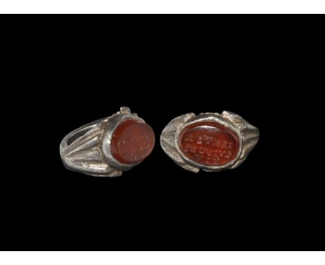 1st-2nd century AD. A silver D-section hoop with keeled edges, flat shoulders with ribbing, discoid cell to the plaque with c