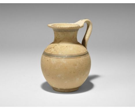 2nd century AD. A globular ceramic jug with tubular neck and flat everted rim, round-section strap handle to the rear; concen