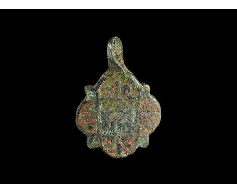 14th-15th century AD. A quatrefoil pendant with loop above; the face ornamented with a central lion passant on a blue enamel 