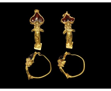 4th-3rd century BC. A matched pair of gold earrings, each a tapering shank with helical ribbing to the lower end, triangular 