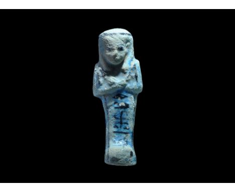 21st-22nd Dynasty, Third Intermediate Period, 1069-850 BC. A blue glazed composition shabti with black pigment detailing to t