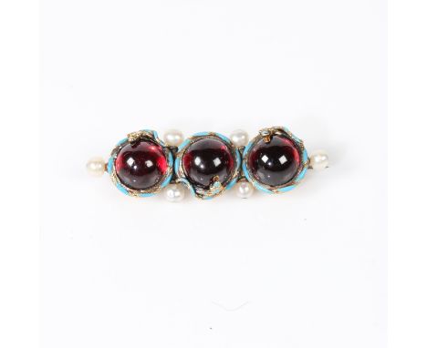 Three round cabochon garnets each measuring approx. 9mm. Each garnet has an coiled enamel blue snake setting. Six fresh water