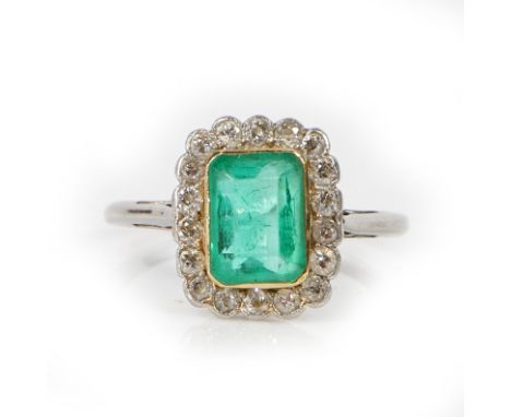 A step cut emerald approx. 1.47ct, measuring 7.9 x 5.7mm. Yellow gold bezel setting. Surrounded with old cut diamonds, TDW ap