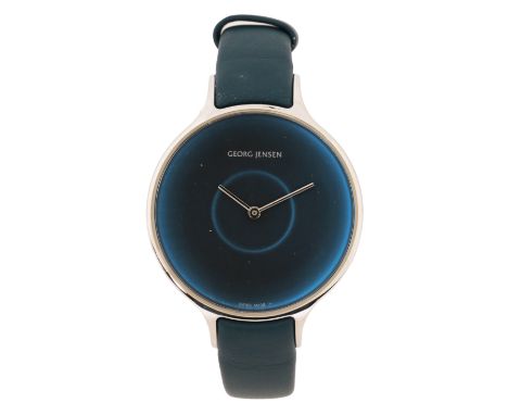 the signed dark blue dial with light blue central ring, quartz movement, the case 38mm diameter, on a blue leather strap with