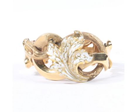 formed from pierced scroll and acanthus leaf links, the central leaf decorated with white enamel decoration, 24.5g.