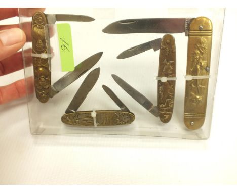 FOUR CONTINENTAL EMBOSSED SOUVENIR FOLDING POCKET KNIVES, LOURDES, ALSACE LORAINE, GENERAL HUNTING SCENE AND A NOVELTY SCENE.