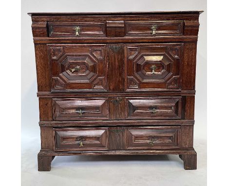 A 17th century oak chest of drawers, in two sections, the four long graduated drawers, on bracket feet, height 102cm, width 1