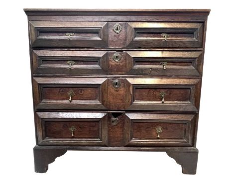 An 18th century oak chest of drawers, with four long drawers on bracket feet, height 86cm, width 90.5cm, depth 49.5cm.
