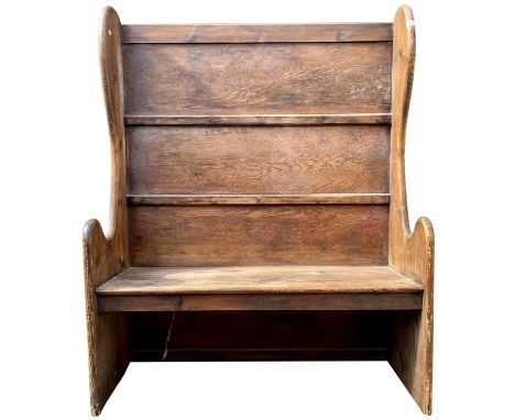 A pine hall bench, circa 1900, the back with a large inserted mirrored plate, height 152cm, width 122cm.
