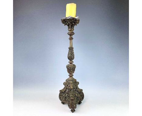 An early-mid 20th century cast brass pricket candlestick, height 62cm.