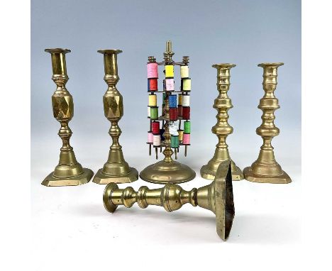 A brass cotton reel stand, circa 1900, height 28cm, two pairs of Victorian brass candlesticks, heights 26cm and 23cm and a si