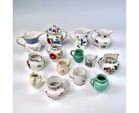 Seven miniature pearlware and creamware jugs, circa 1820, variously decorated in polychrome colours, together with seven othe