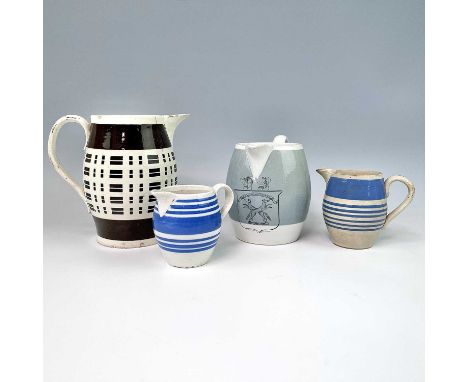 A creamware engine turned and brown glazed jug, circa 1820, height 15cm, together with two smaller creamware jugs, decorated 