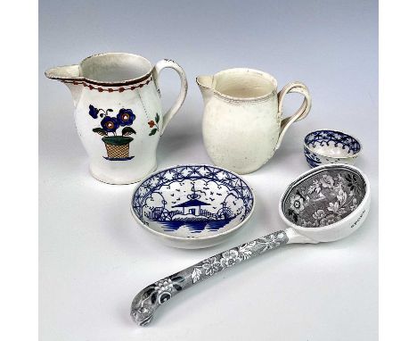 A pearlware jug, circa 1800, height 8.5cm, a small probably Leeds creamware jug, with moulded entwined handles, height 7cm, a