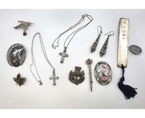A replica Mackintosh silver cross with enamel work and chain, a silver hummingbird brooch, a Thai silver brooch, a sterling s