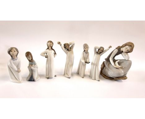 Five Lladro and two Nao figures of young girls, 15cm to 24cm. (candle flame lacking) (7)