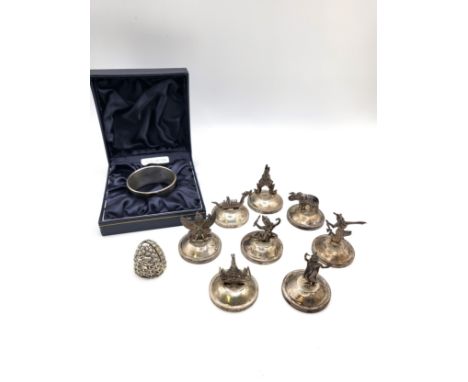 A silver napkin ring Rolason Brothers, Birmingham 1919  10gms, eight stamped sterling Thai place settings 392gms 4.5cm  , and