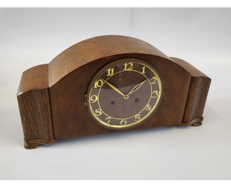 A 1940's Art Deco-style mantle clock with gold fittings. 23cm x 46cm.